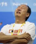 图文-刘翔因伤退出110米栏比赛 刘翔的教练孙海平