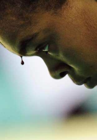 图文-路透社北京奥运最佳图片 鲜血与不屈眼神