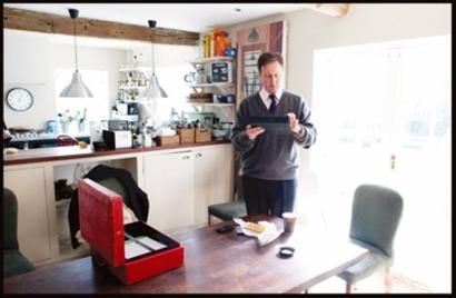 Cameron uses IPad to handle official business when lunching in the home. 