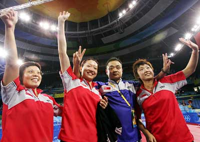 China-born Wang Yuegu, Feng Tianwei, coach Liu Guodong and Li Jiawei