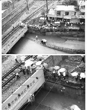 武汉铁路涵洞渍水行人冒险穿越铁轨(图)