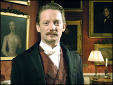 An actor playing Conan Doyle, author of the Sherlock Holmes novels