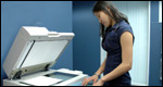 A girl photocopying a document