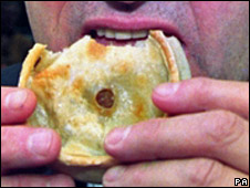 A man eating a pie