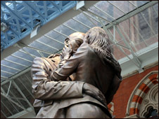 The statue underneath the clock