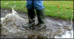 Boots splashing in water