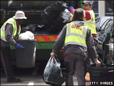 Men collecting rubbish