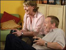 Two people playing a computer game