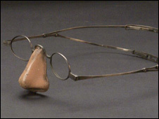 A fake nose attached to a glasses frame