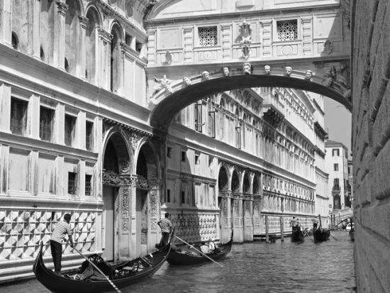 Gondolas pass under the Bridge of Sighs in Venice. Source: Supplied