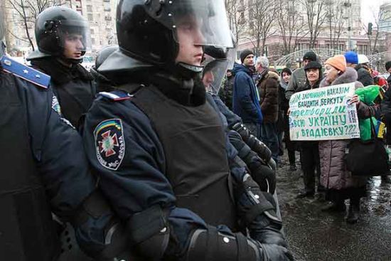 Police in riot gear moved to regain control of key areas in the government district of Kyiv on Dec. 9.
