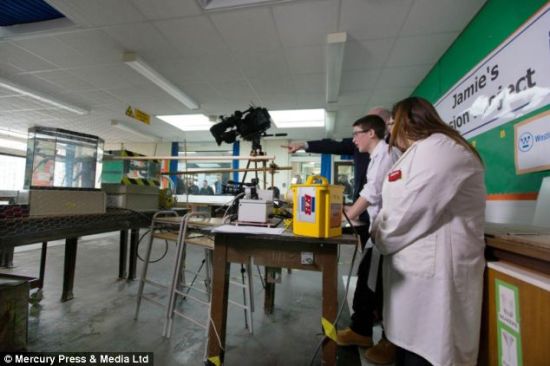 In an incredible eureka moment head teacher Jim Hourigan can be seen pointing to the experiment as a Geiger counter registers Jamie's fusion reaction has taken place