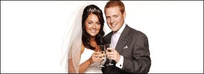 A bride and groom drinking champagne