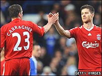 Liverpool's Xabi Alonso congratulated by Jamie Carragher