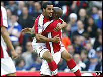 Theo Walcott celebrates a goal with a team mate