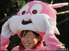 A girl in a pink rabbit costume