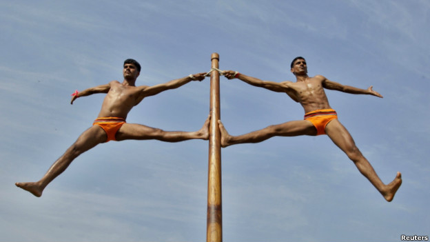 Indian army soldiers perform Malkhamb during an army exhibition.